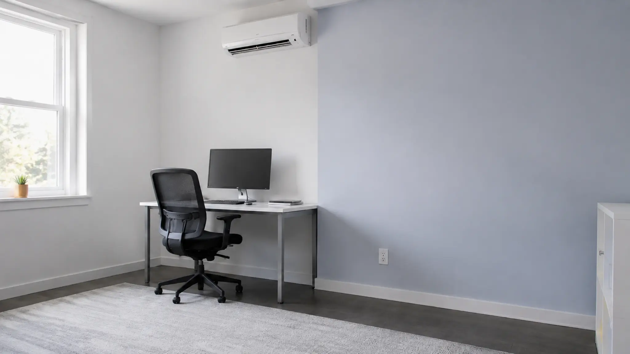 Empty office with a wall-mounted air conditioner after the room is vacated